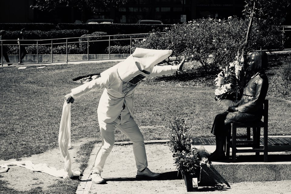 Article photograph of a memorial performance beside Glendale’s comfort-women statue