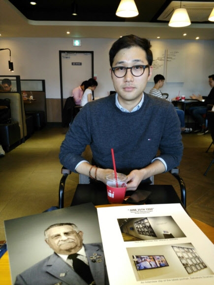 Photographer Seungwoo Kim pictured with his veterans project